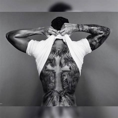 Lewis hamilton has two amazing new tattoos done during the off seasoncredit: Lewis Hamilton's back tattoo of a cross and angel wings