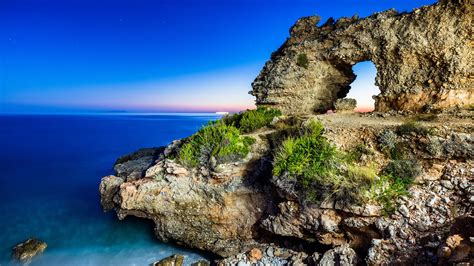 Natural Arch Rock Formation At Dhërmi Beach Near Himarë Vlorë County