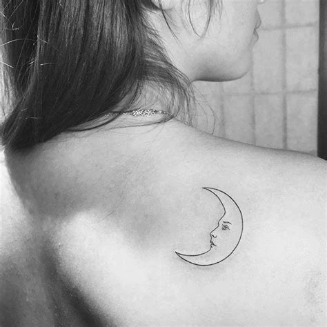 Crescent Moon Tattoo On The Right Shoulder Blade