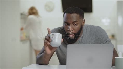 Sad Black Man Working Laptop At Open Kitchen Crazy Young Guy Typing