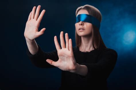 Premium Photo Girl Blindfolded With Blue Ribbon Looking For