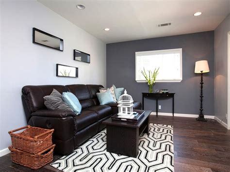 This Spare Gray Living Room Is Accented By A Darker Gray Accent Wall And Livened Up With A Geom