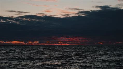 Download Wallpaper 2048x1152 Sea Horizon Sunset Clouds Ultrawide