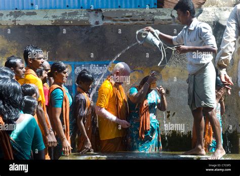Hindu Pilgrims Receiving The Holy Bath At The Ramanathaswamy Temple