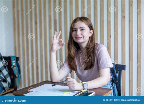 Girl Is Doing Homework In The Classroom Back To School Cute