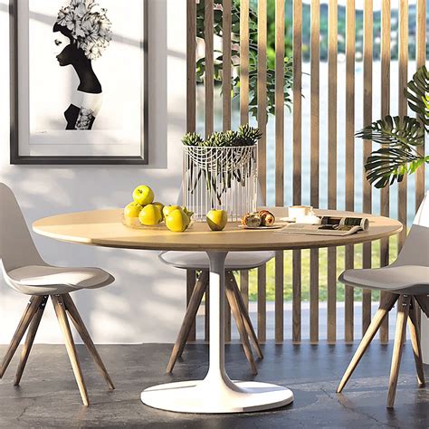 A moden table with solid beech legs, suitable for dining or working. Tulip Round Dining table - Living with Style