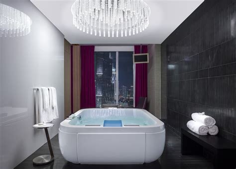 Rising gracefully amid the skyscrapers of downtown dubai, the hotel's blue mirrored façade reflects. Fotos Hotel Sofitel Dubai Downtown. Bilder Hotel Sofitel ...