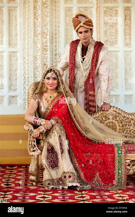 Indian Bride And Groom In Traditional Wedding Dress Stock Photo