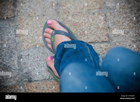 Girl With Nail Polish And Flip Flop Sandals Blue Jeans Relaxing On Holiday Free Spirit Stock