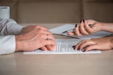 Hands Of Contractual Parties A Woman And A Man Signing A Contract