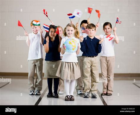 School Children Waving Flags Of Different Countries Stock Photo Alamy