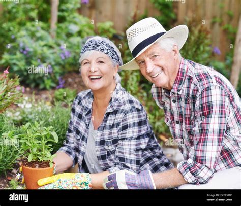 Gardening Is Our New Hobby A Happy Senior Couple Busy Gardening In