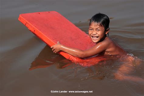 Swimming On The Tonle Sap Cambodia John Lander Photography