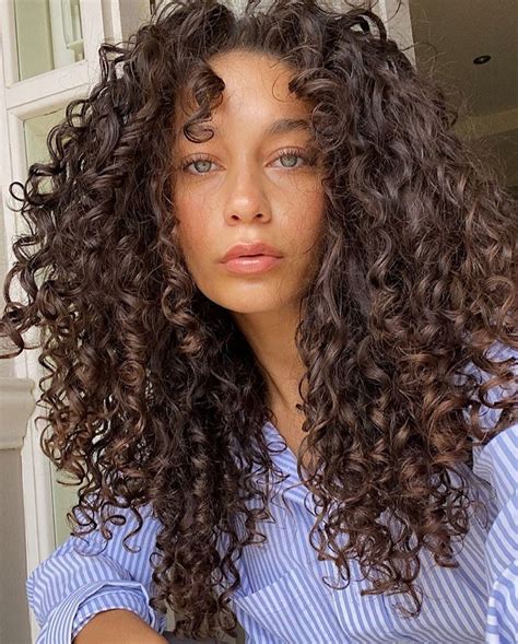 long curly hairstyles with bangs