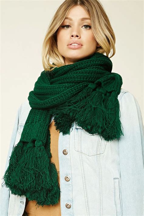 A Dark Green Knitted Scarf That Basically Looks Like The Holidays
