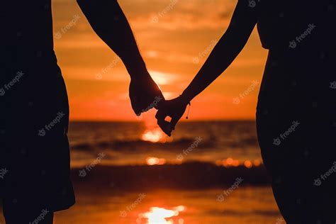 Premium Photo Love Romantic Couple Holding Hands Beach Sunset Lovers Or Newlywed Married