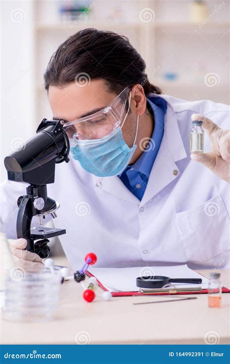 Young Male Chemist Experimenting In Lab Stock Image Image Of Control