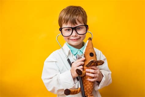 Premium Photo Cute Small Kid Boy Wear Medical Uniform Glasses Holding
