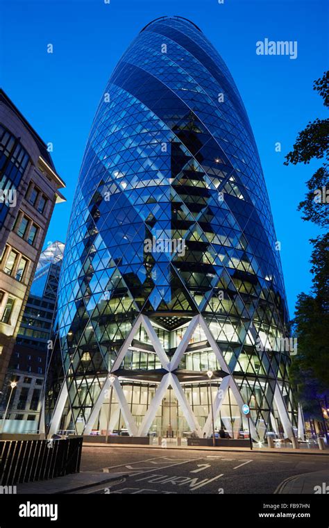 30 St Mary Axe Building Or Gherkin Illuminated At Night In London Stock