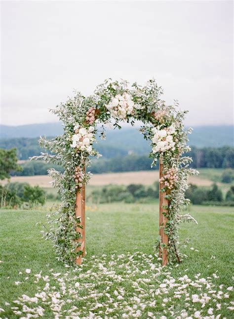 Outdoor Wedding Altar With Vines And Flowers At Pippin Hill Farm