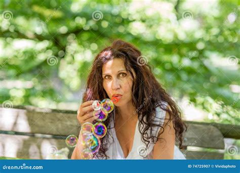 Adult Woman Blowing Soap Bubbles Stock Image Image Of Soap Playing