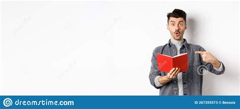 Excited Guy Read Interesting Thing In Journal Pointing At Planner And