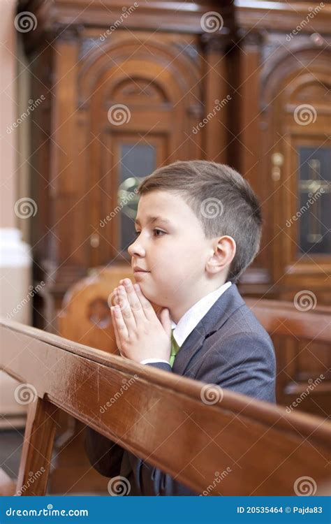 Boy Kneeling And Praying In The Church Stock Photo Image 20535464
