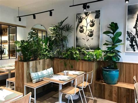 Set the kitchen and cooking elements of the design to one side and keep it contained, only a short distance away from a dining area. Contemporary Organic Restaurants : Kitchen Garden Restaurant