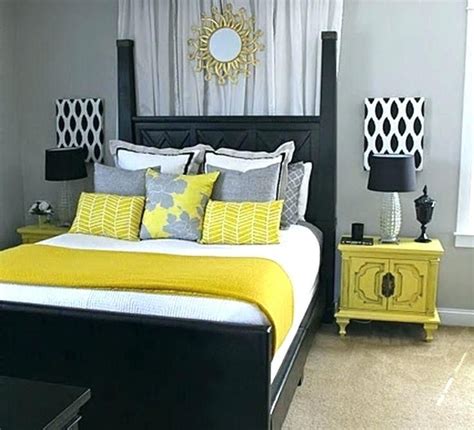 Using large grey flowers in yellow background for the bed cover make this bedroom one a lovely yellow and grey bedroom that also uses stripe patterns. grey and yellow bedroom ideas black white and yellow party ...