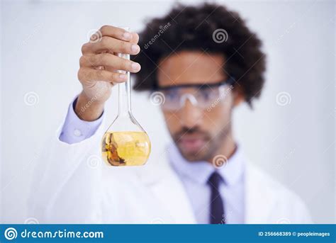 This Looks Promising A Male Scientist Conducting An Experiment In His