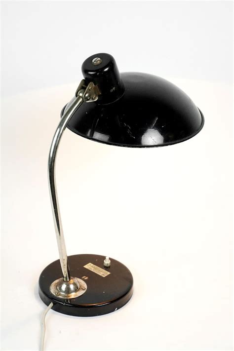 The outlet on the base will save you the hassle of having to climb under your. Black Mid-Century Modern Table Lamp, Austria, 1950s For Sale at 1stdibs