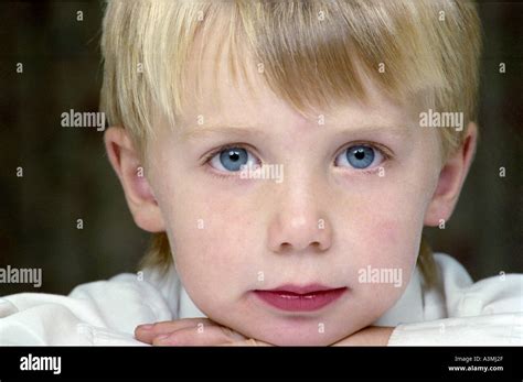 Young Boy Blue Eyes And Blond Hair With Fringe Stock Photo Alamy