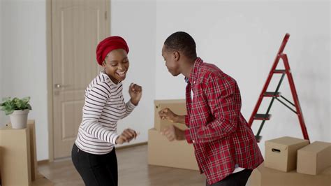 Happy African American Couple Dancing Having Fun Celebrating Moving