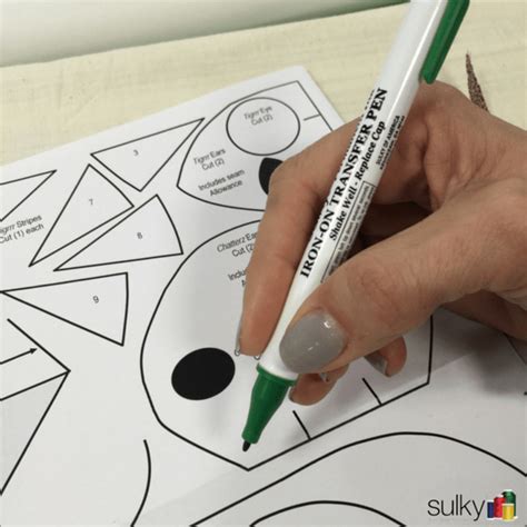 You draw the design you wish to embroider directly on your fabric. Using Sulky Iron-On Transfer Pens - Sulky