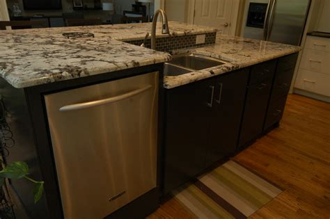 Dishwashers can be located away from the sink cabinet, but generally they need to be within a few feet so the sink plumbing can be used for the water often the dishwasher can be installed with a little creative cabinet remodeling. Raised Dishwasher | Explore gcdinc's photos on Flickr ...