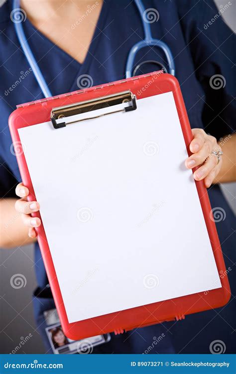 Nurse Holding Out Blank Clipboard Stock Image Image Of Sign Scrubs