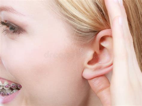 Woman Listening Carefully With Hand Close To Ear Stock Photo Image Of