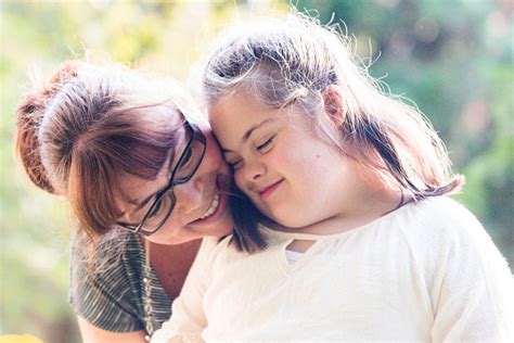 Portrait Of A Mother With Her Daughter Of 12 Years Old With Autism And
