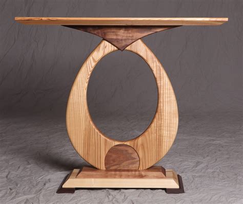 The rectangular frame above with contrast color from the table gives perfect view from the front. Hand Made Koala Buddha Entryway Table by Numana Woodcraft | CustomMade.com