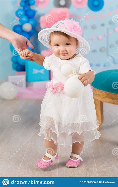 Cute Little Baby Girl With Big Blue Eyes Wearing Tutu Hat