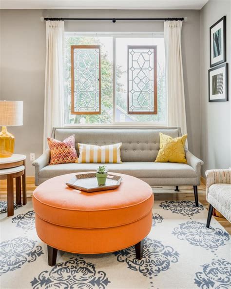Gray Transitional Living Room With Round Ottoman Orange And Grey
