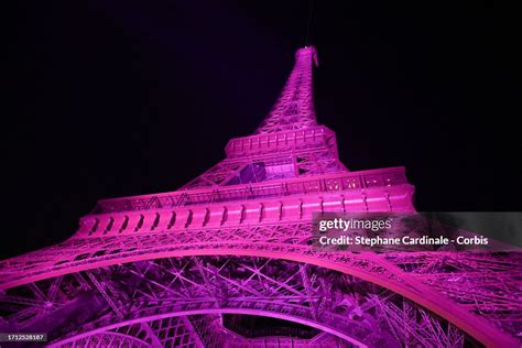 The Eiffel Tower Is Illuminated In Pink For Octobre Rose To Mark