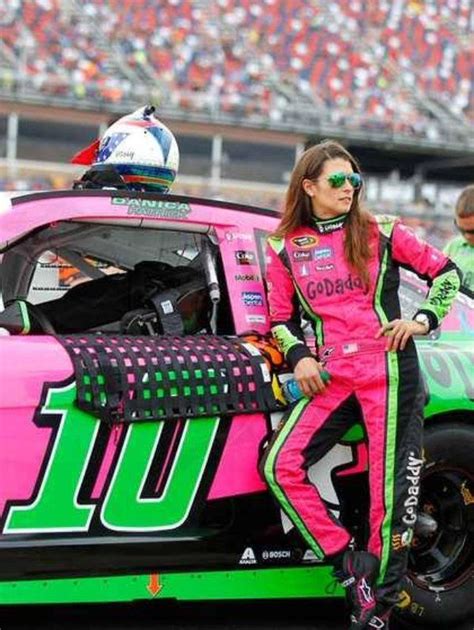 The Quintessential Racer Danica Patrick Stands By Her Race Car At