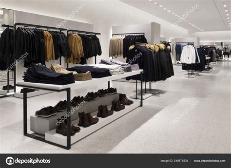 Modern Fashionable Brand Interior Of Men Clothing Shop Store Inside