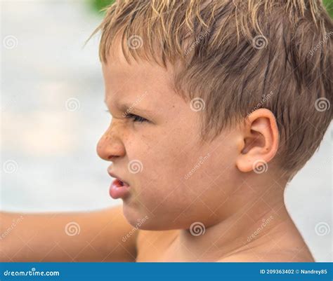 Side Portrait Mischievous Cute Blond Kid Boy Freckled Face Angry Mood