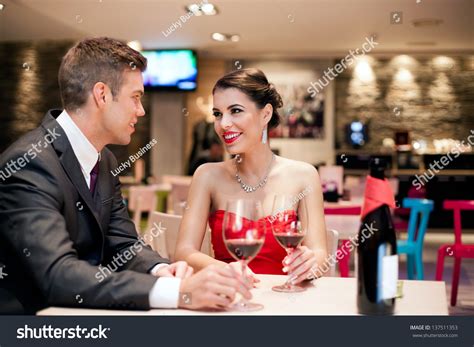 Romantic Young Couple On First Date In Restaurant Stock Photo 137511353