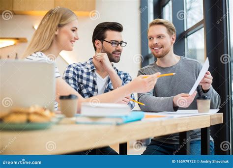 Smart Young People Looking At The Document Stock Image Image Of