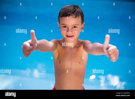 Shirtless Boy Gesturing At Swimming Pool Stock Photo Alamy