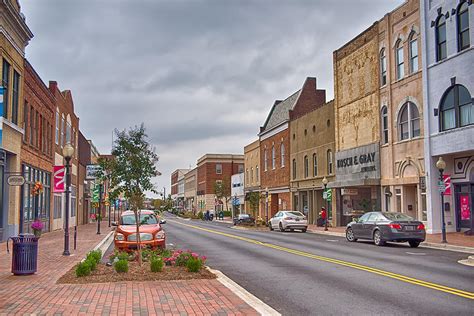 Spartanburg, sc is an amazing place for outdoor adventure, restaurants, and events that cover the broadest spectrum of interests. Spartanburg South Carolina City Skyline And Downtown Surrounding Photograph by Alex Grichenko