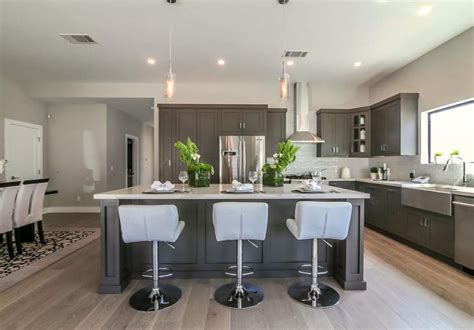 Face framed cabinets are traditionally built cabinets with a 1 1/2 face frame that covers the front of the cabinet box. Dark Grey Inset Cabinets - Nu Image Interior Design